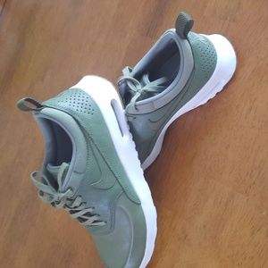 Green Nike leather sneakers.